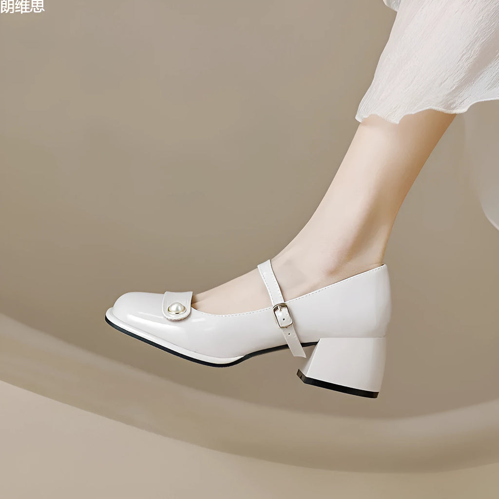 Women's apricot patent leather chunky heel ankle boots with a square toe and ankle buckle.