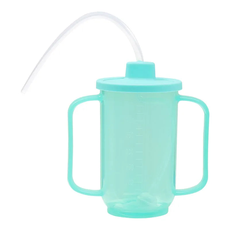 Adult angled spout anti-choke drinking cup with handle and lid, shown with optional wrist splint attachment