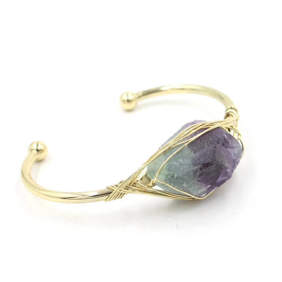 Natural raw gemstone bracelet with 8mm amorphous crystal beads on a white background.