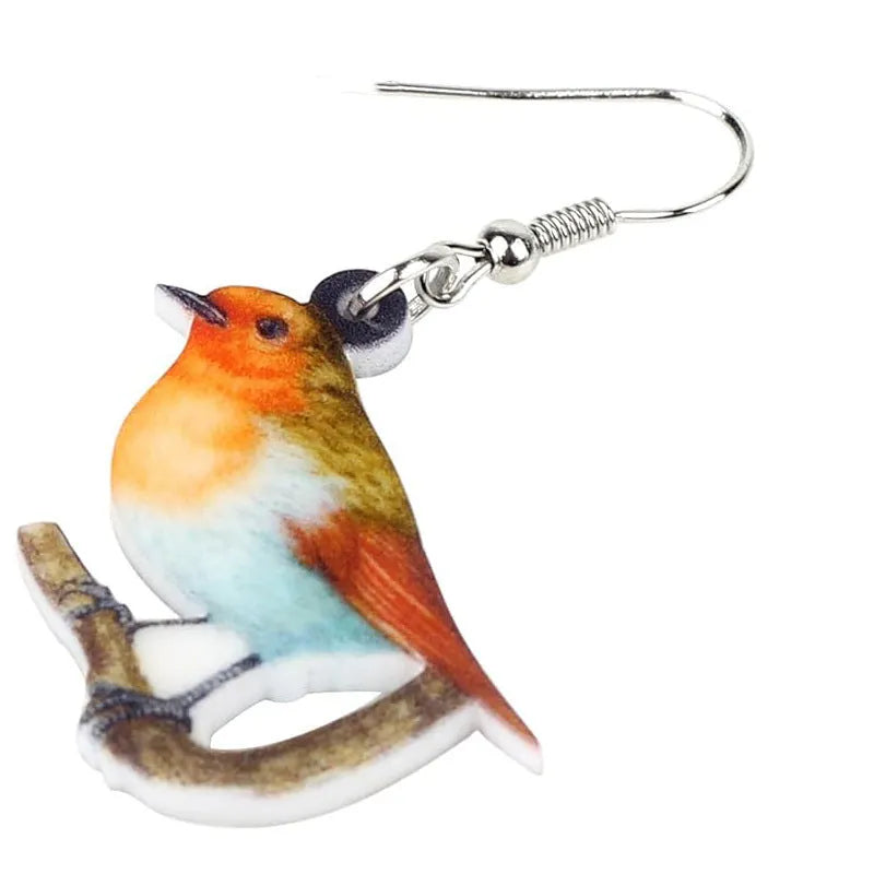 Blue Titmouse bird charm acrylic drop earrings with geometric patterns on clear pendant and silver steel posts.