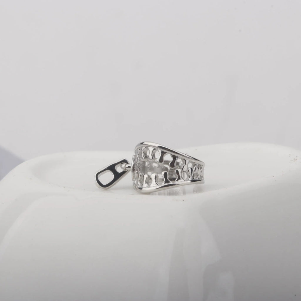 Geometric copper ear bone clip earrings with zipper clip design and line pattern details in colour ES862