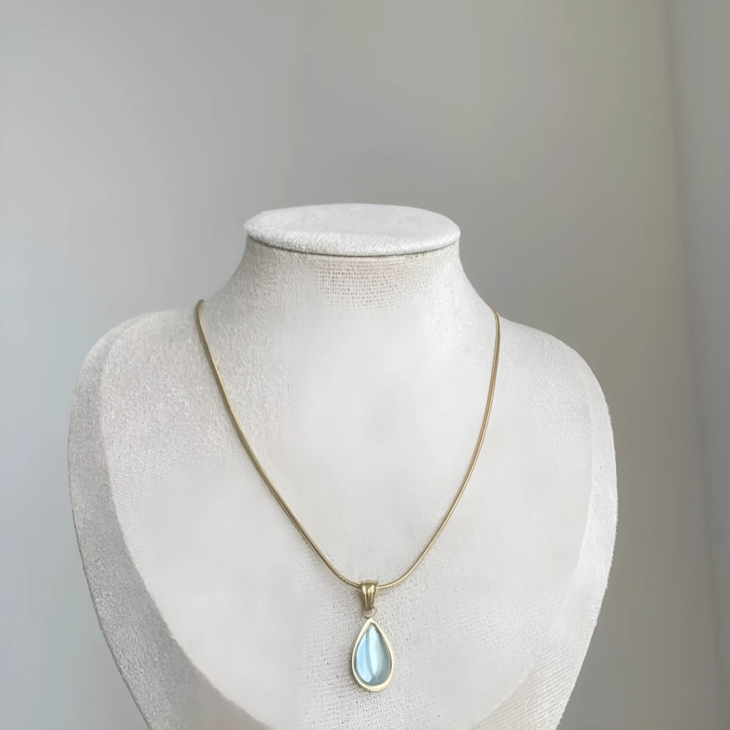 Retro blue and green water drop necklace with mixed gem inlay on a titanium steel snake bones chain.
