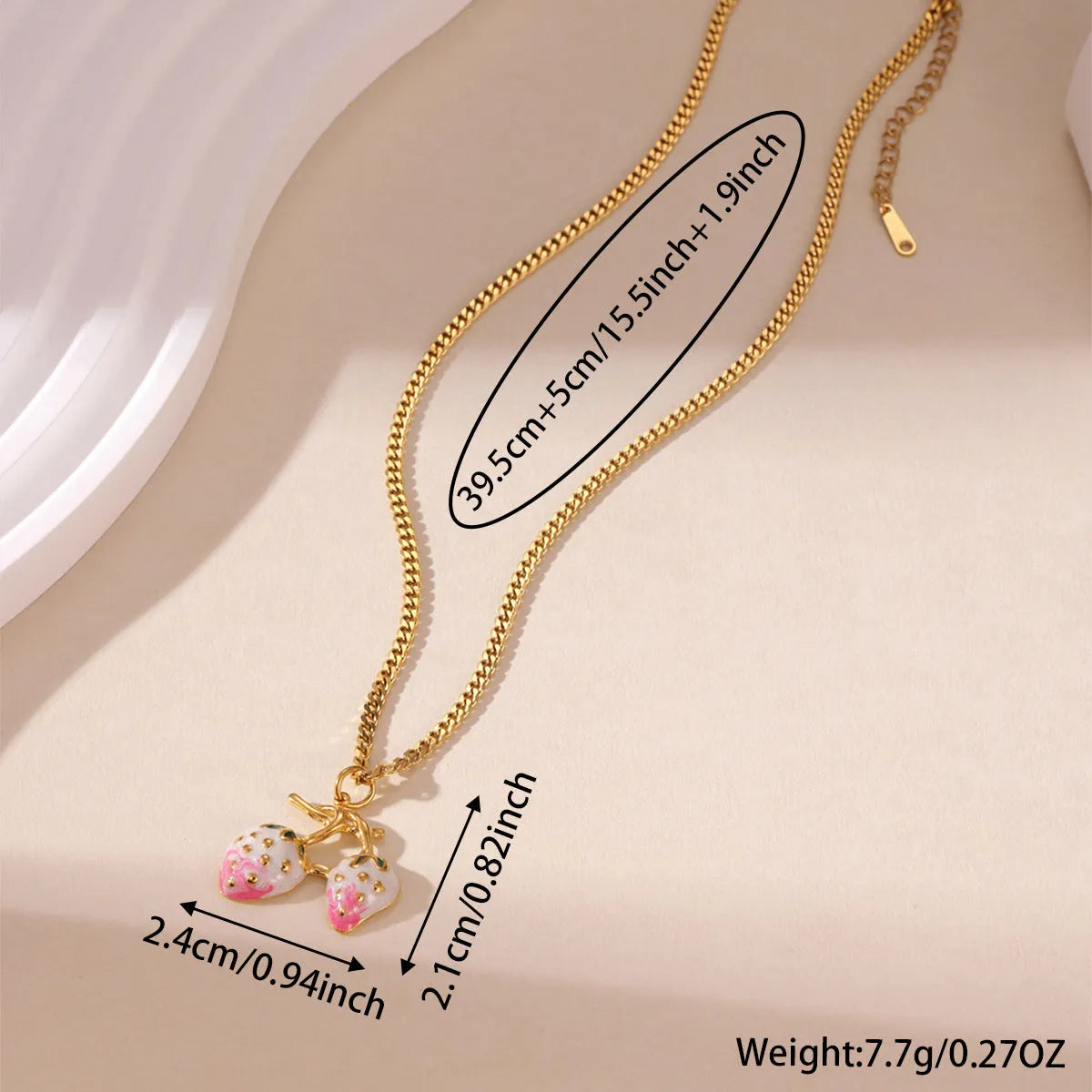 Strawberry fruit charm pendant necklace on a metal chain, shown in red and white gradient colour options.