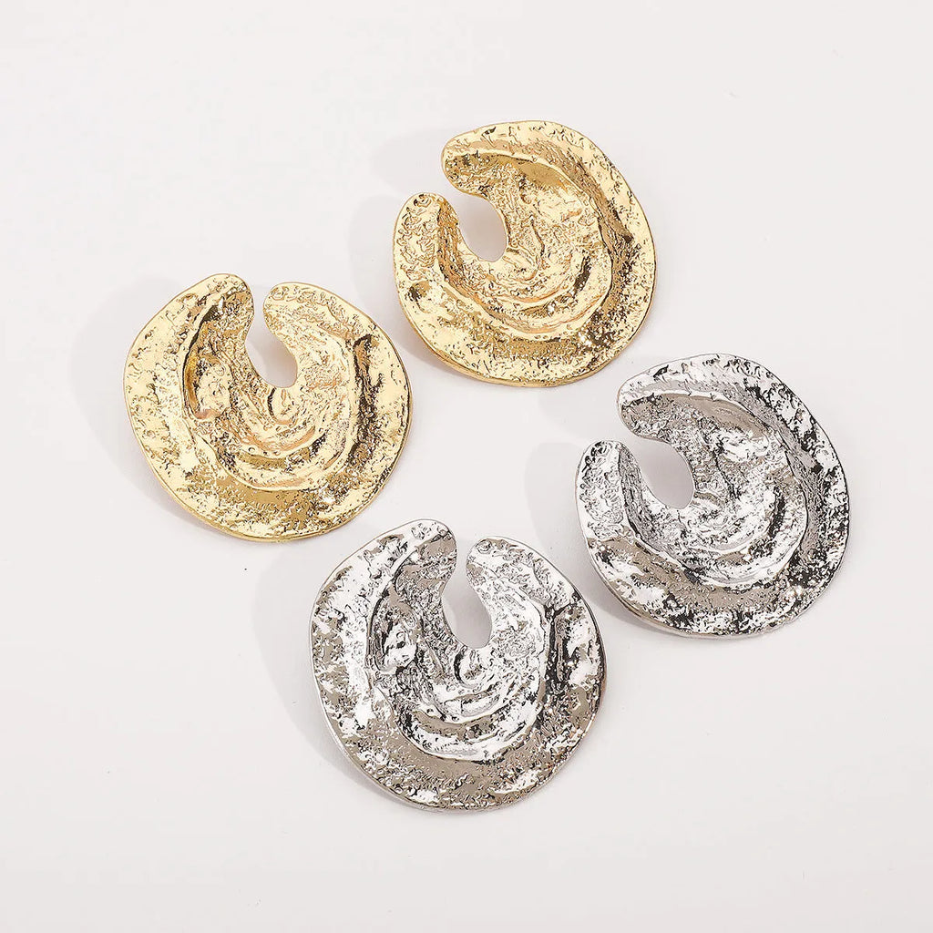 Exaggerated geometric women's earrings with irregular pleats and a concave-convex texture in gold colour