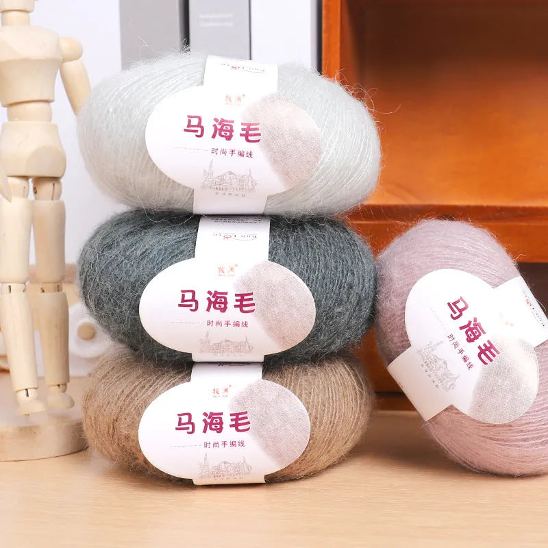 Single 100g ball of mohair yarn for a DIY hand-woven scarf kit, showing the fluffy texture.