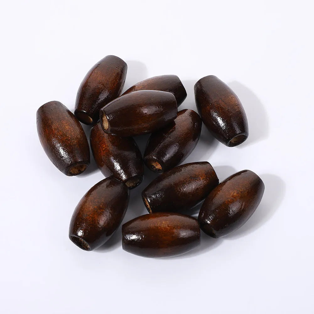 Oval M-shaped wooden bead in dark coffee colour, 25mm diameter with raised texture.