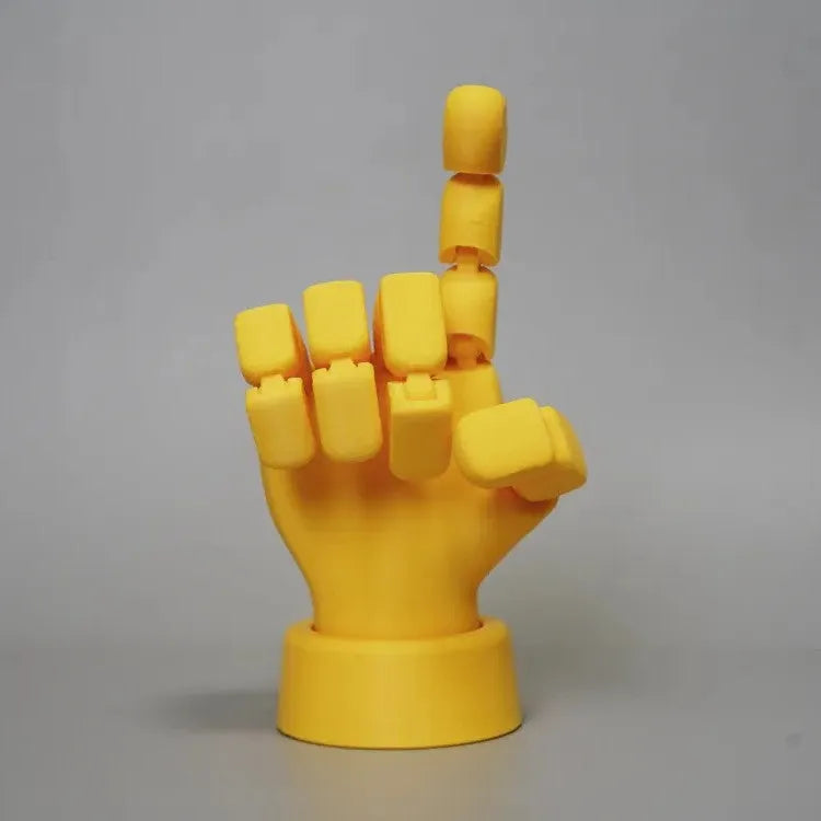 Yellow PLA plastic hand prop figurine with movable joints on a white background.