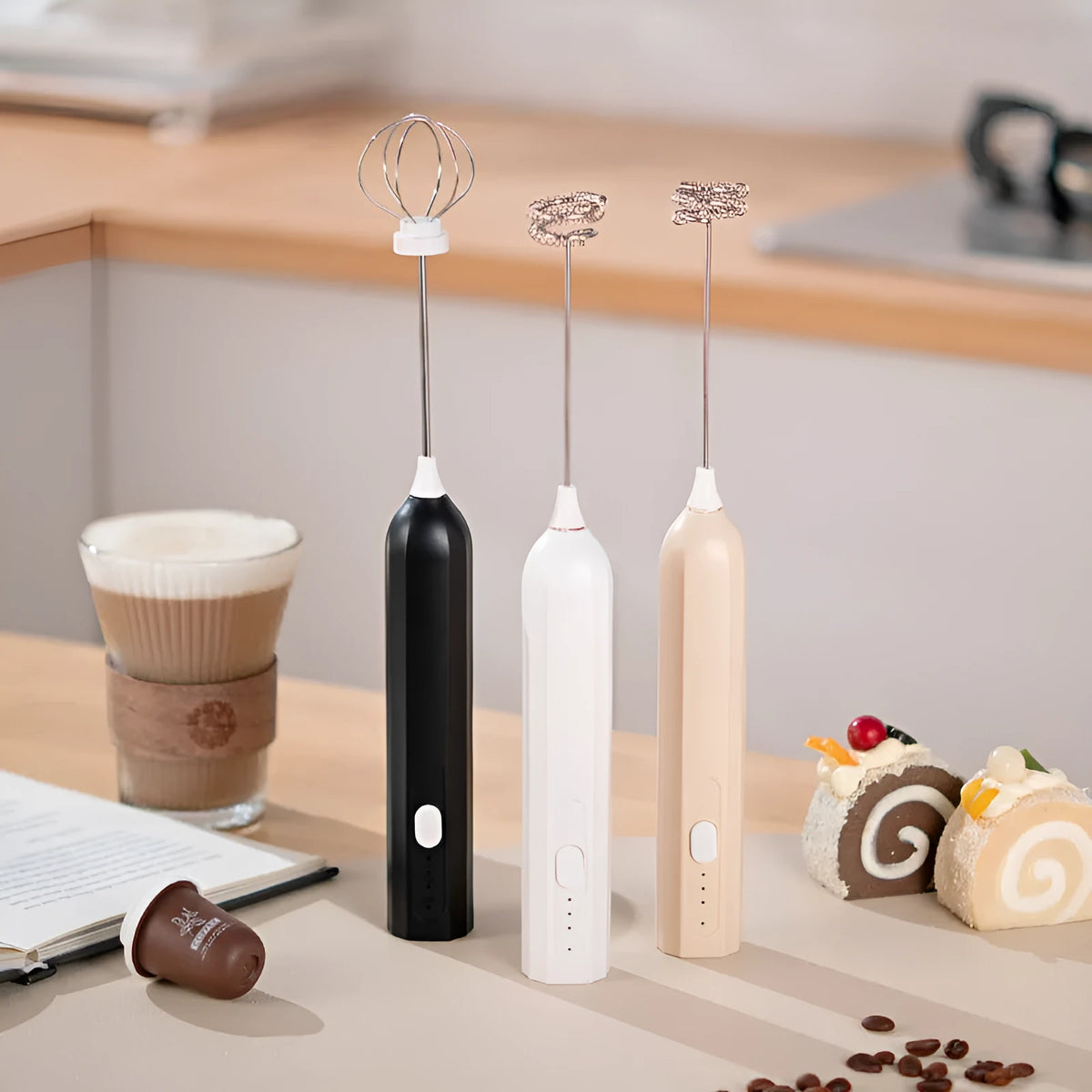 Handheld electric whisk in white, black, or apricot with USB rechargeable wireless design and three speed settings