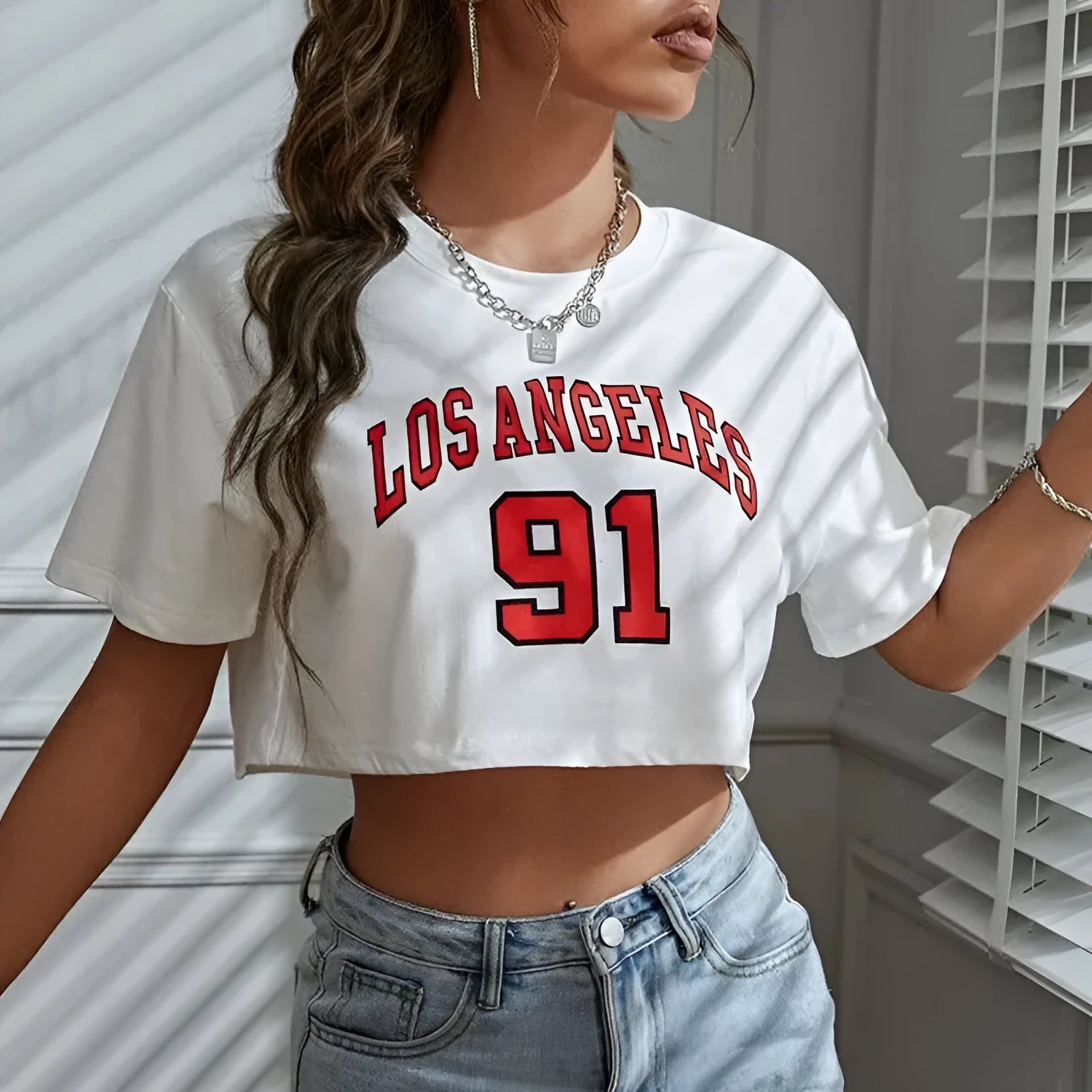 Loose fit cotton t-shirt with large printed English letters on the front in a casual style.