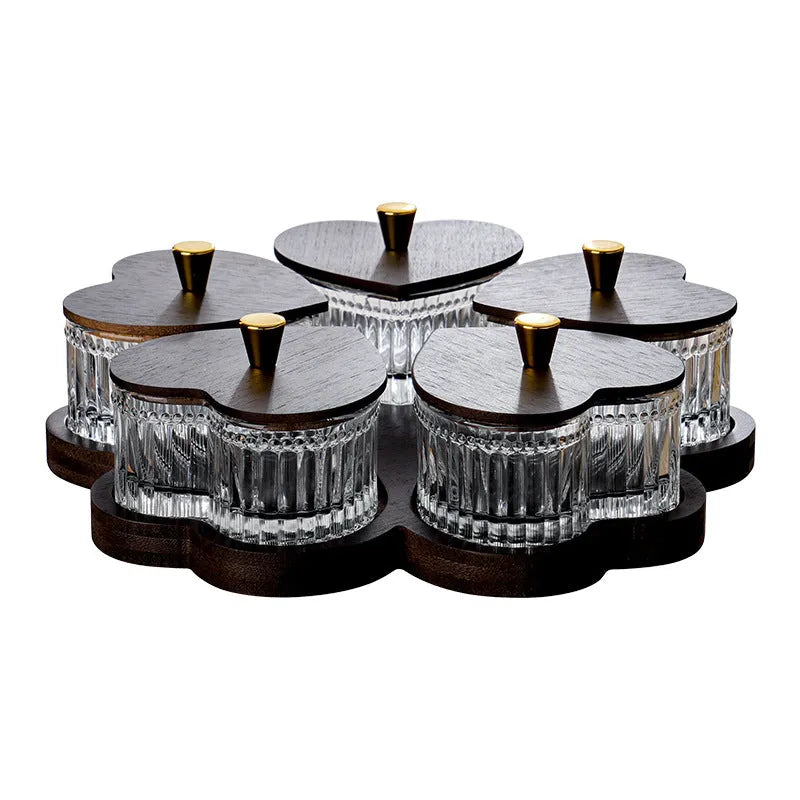 Glass fruit and snacks serving platter with multiple compartments and transparent heart-shaped lids in a retro style.