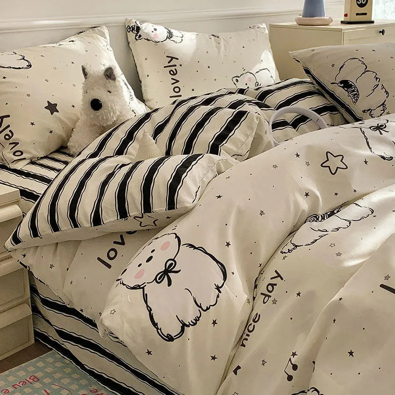 Cartoon dog print cotton duvet cover and pillowcases on a bed, part of a four-piece bedding set.