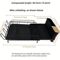 A retractable, foldable carbon steel dish rack for draining cutlery, knives, forks and cups on a kitchen countertop.