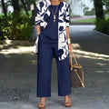 Women's blue printed casual three-piece suit featuring a long coat, waistcoat, and trousers on a hanger.