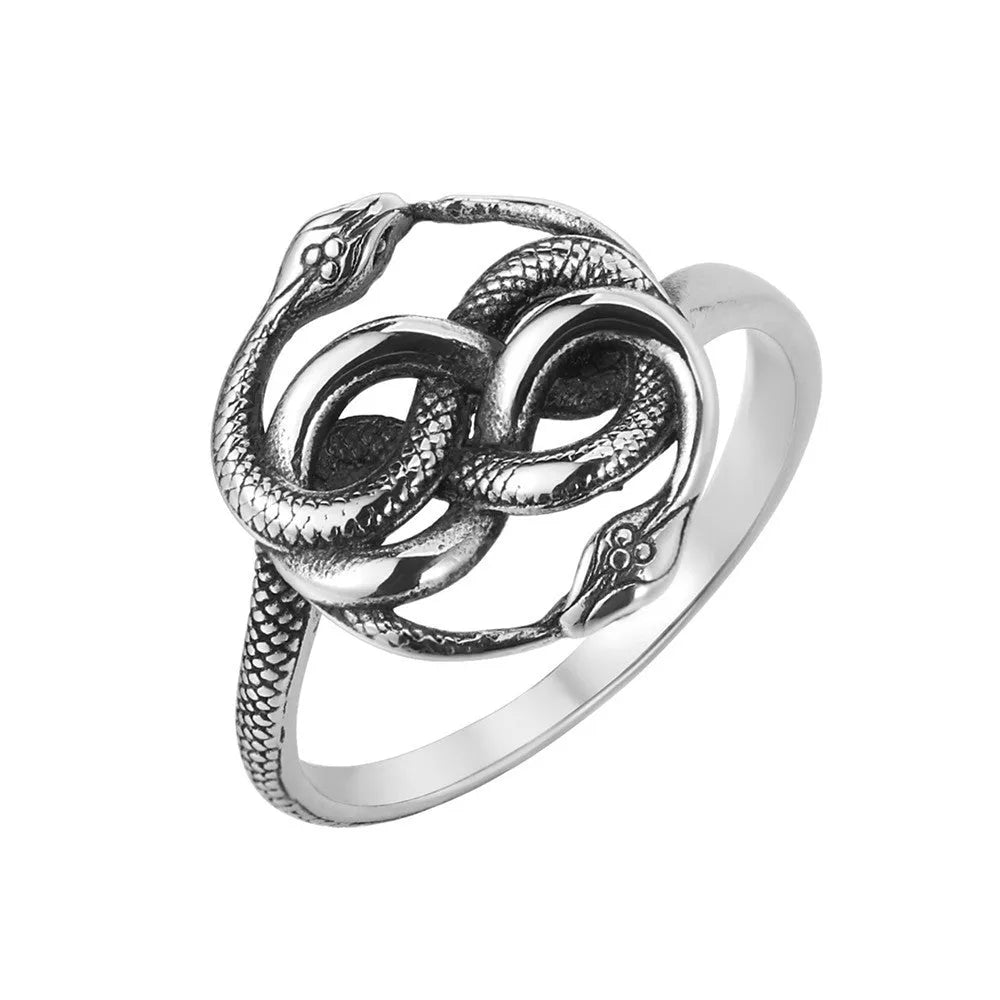 Close-up of a retro-style titanium steel double snake ring in a steel colour on a hand.