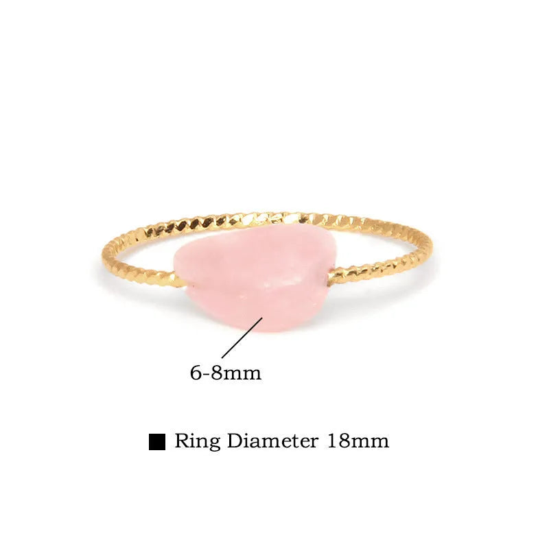 Women's geometric ring made from colourful agate stone on a neutral background.
