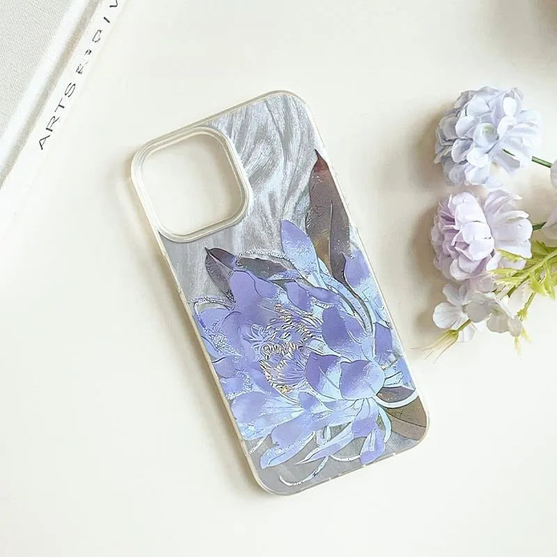 Blue Lotus light luxury hard PC phone case for Apple iPhone on a table.