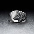 Men's silver geometric wolf head ring made from alloy on a grey background.