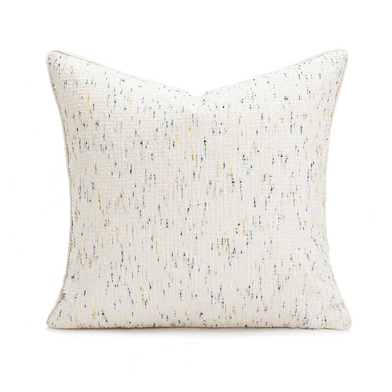 A square pp cotton pillow cushion with a solid red-brown abstract print cover on a sofa.