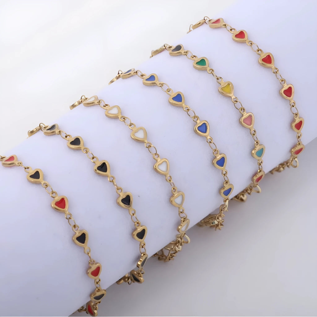 Heart-shaped stainless steel bracelet with adjustable length in multiple colour options including black, red and sapphire blue