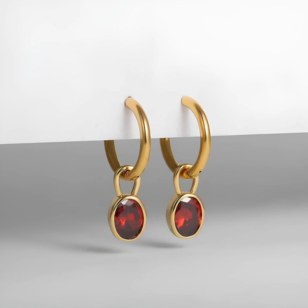 Close-up of a women's retro-style oval zircon earring in copper, showing elliptical stone setting and textured metal finish.