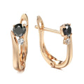 Gold geometric drop earrings with black agate stone accents on copper base