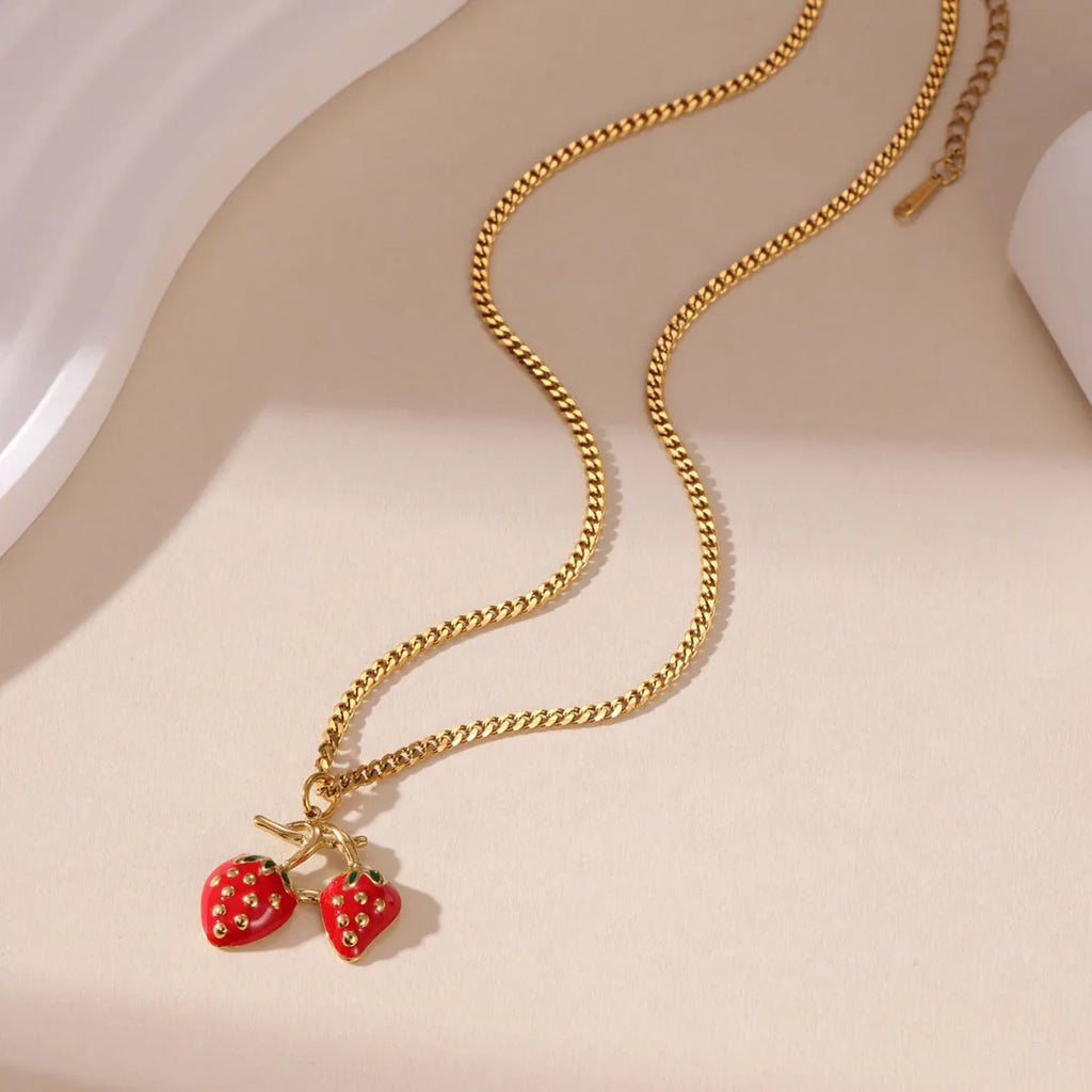 Strawberry-shaped pendant necklace for women in red or white gradient on a stainless steel chain.