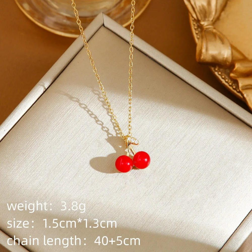 Red titanium steel necklace with a delicate alloy pendant shaped like cherries, strawberries, and peppers on an O-ring chain.