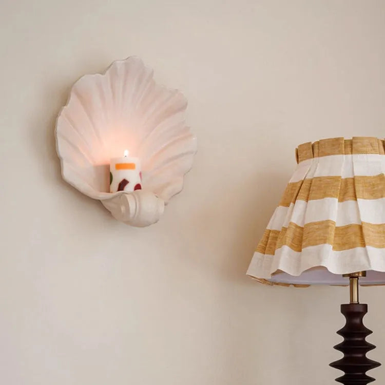 White resin fruit plate ornament with simulated shell storage design on wooden table