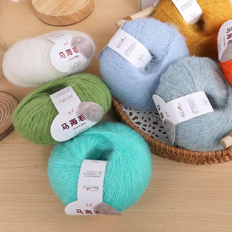 Single 100g ball of mohair yarn for a DIY hand-woven scarf kit, showing the fluffy texture.