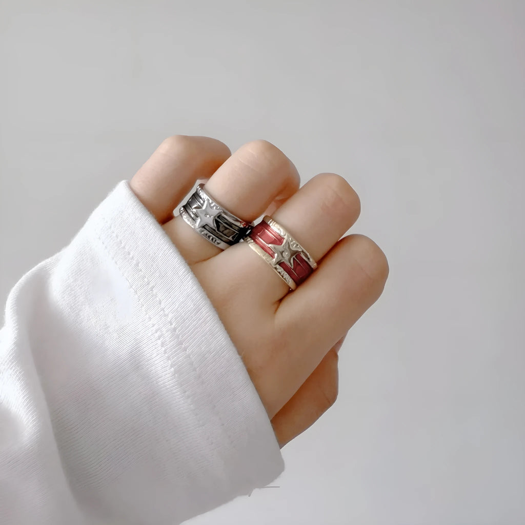 Geometric adjustable copper ring with a distressed XINGX drop oil pattern in multiple colour options.