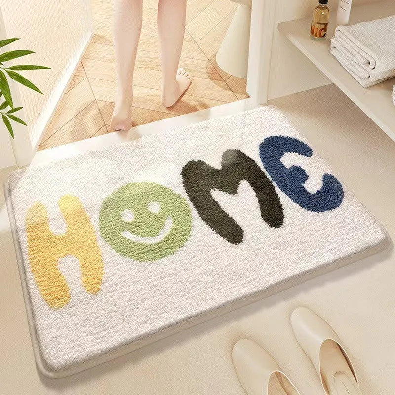 Square rainbow print floor mat with sky and sea colours on a wooden floor
