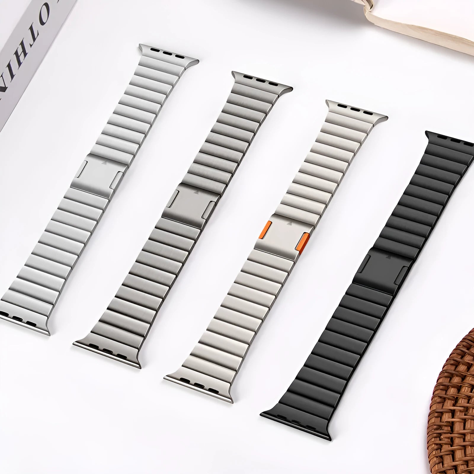Stainless steel magnetic buckle watch strap for Apple Watch in silver colour on a grey background