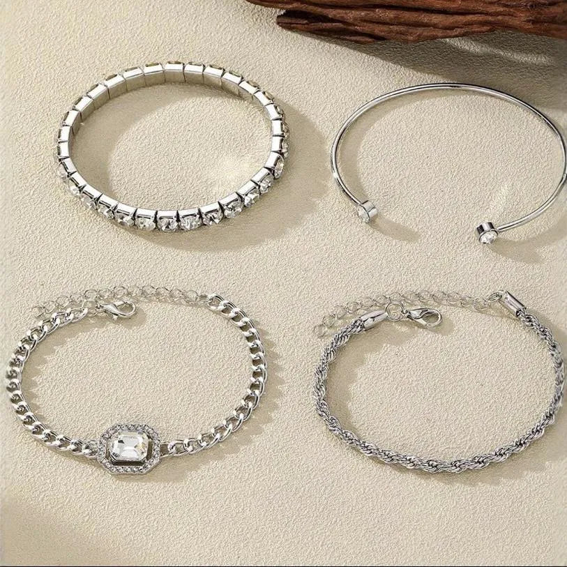 Retro geometric alloy bracelet four-piece set with square diamond details in gold and silver colours.