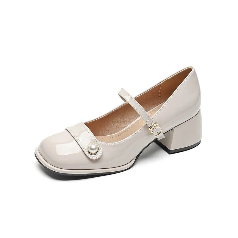 Women's apricot patent leather chunky heel ankle boots with a square toe and ankle buckle.