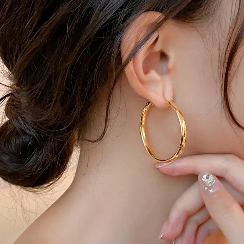 40mm circular metal earrings with gold or silver electroplated finish on copper