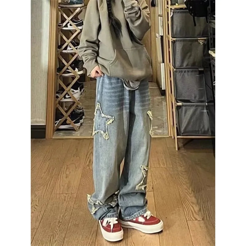 Blue women's straight-leg jeans with a high waist on a neutral background.