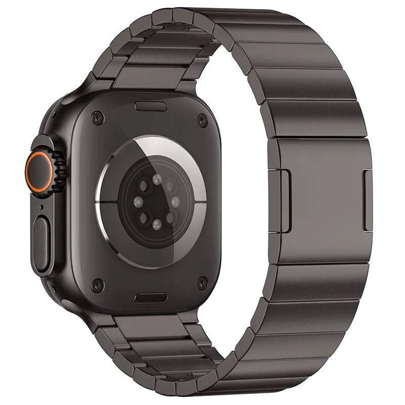 Stainless steel magnetic buckle watch strap for Apple Watch in silver colour on a grey background
