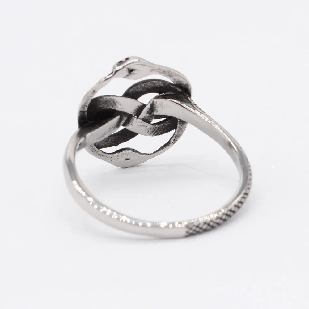 Close-up of a retro-style titanium steel double snake ring in a steel colour on a hand.