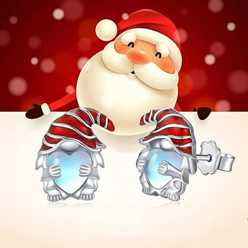Close-up of women's heart-shaped earrings with a Santa Claus design in a white gold colour finish.