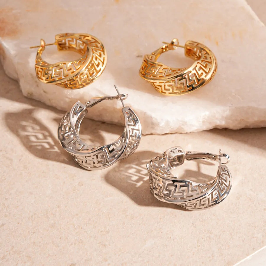 Gold and silver geometric women's hollow stud earrings with a twisted round design