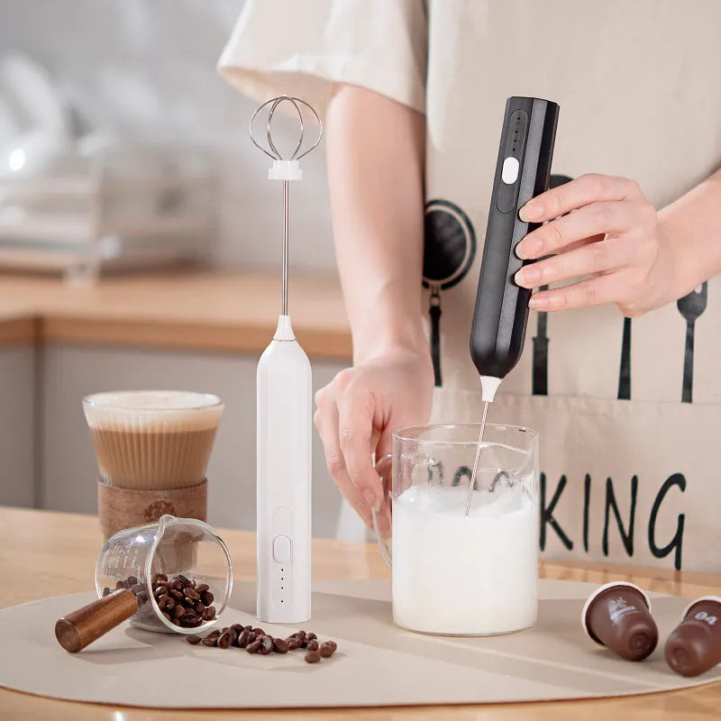 Handheld electric whisk in white, black, or apricot with USB rechargeable wireless design and three speed settings