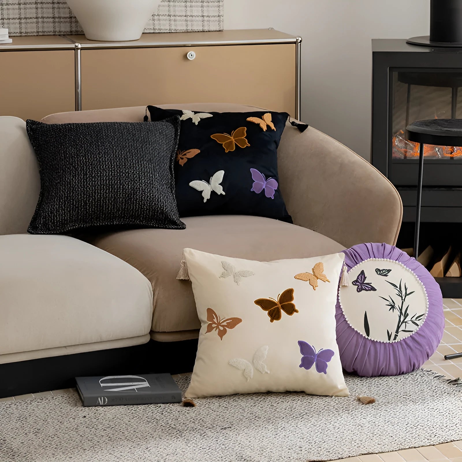 Square beige couch pillow with embroidered Chinese-style butterfly design.