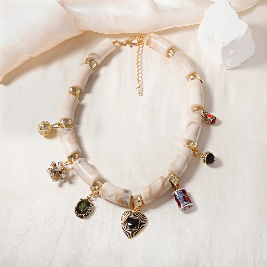 Gold-tone heart-shaped resin bamboo pendant necklace with electroplated chain