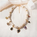 Gold-tone heart-shaped resin bamboo pendant necklace with electroplated chain