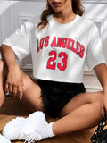 Black cotton crop top T-shirt with printed white English letters, loose fit and short sleeves.