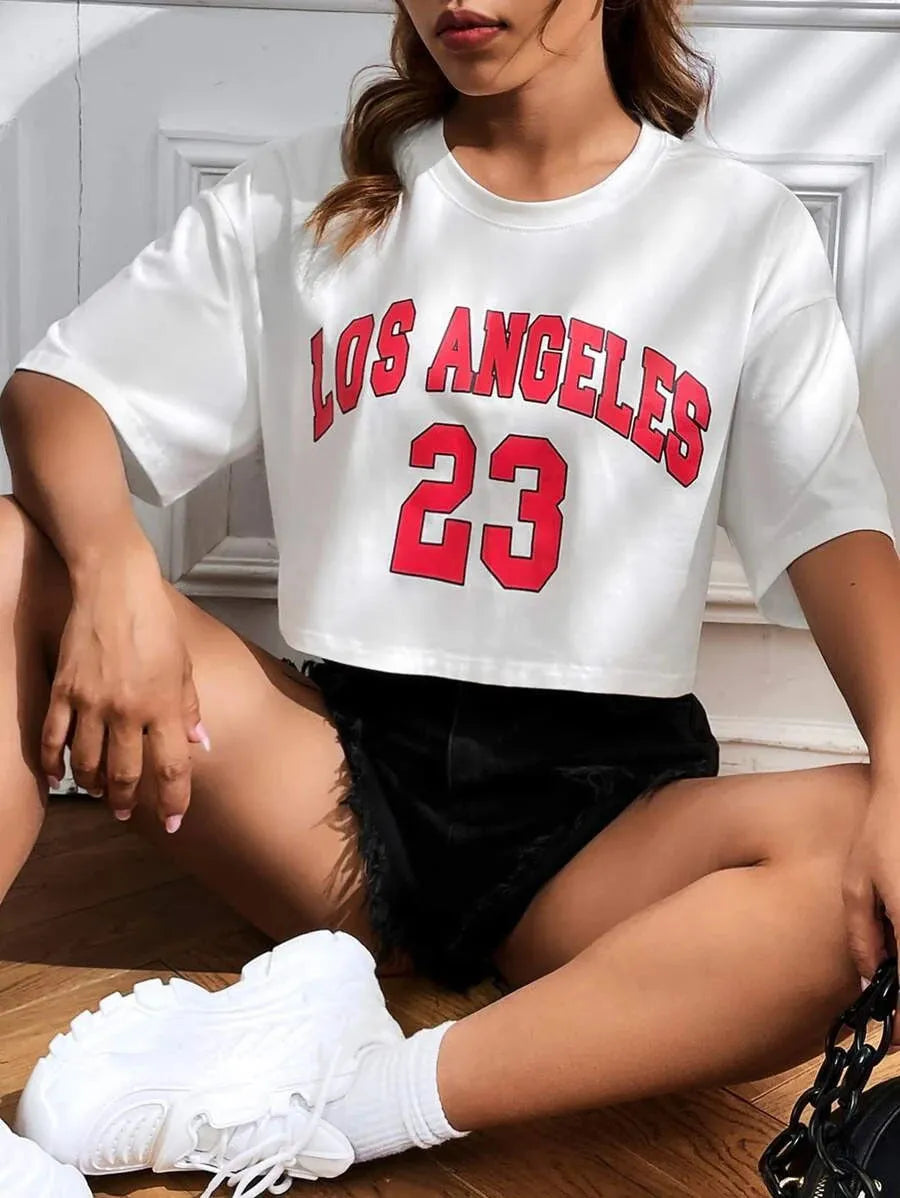 Black cotton crop top T-shirt with printed white English letters, loose fit and short sleeves.
