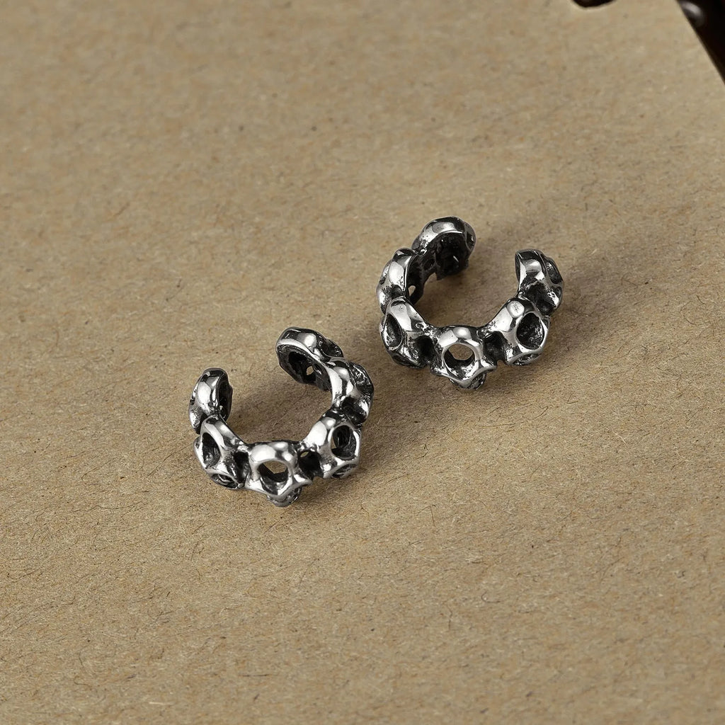 Retro skull design stainless steel ear clips with hollow geometry and electroplated finish