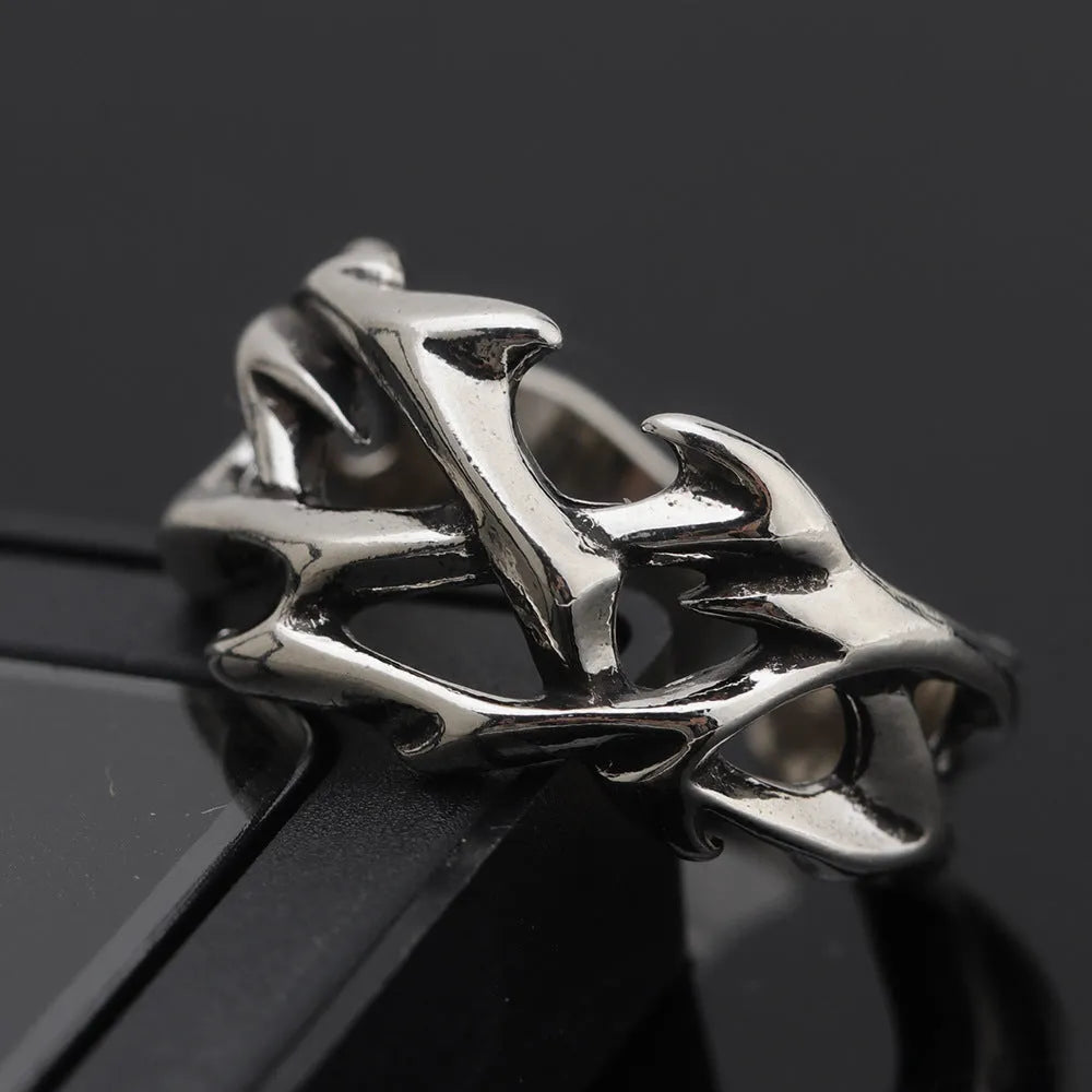 Copper men's ring with thorn flower design and adjustable geometric opening.