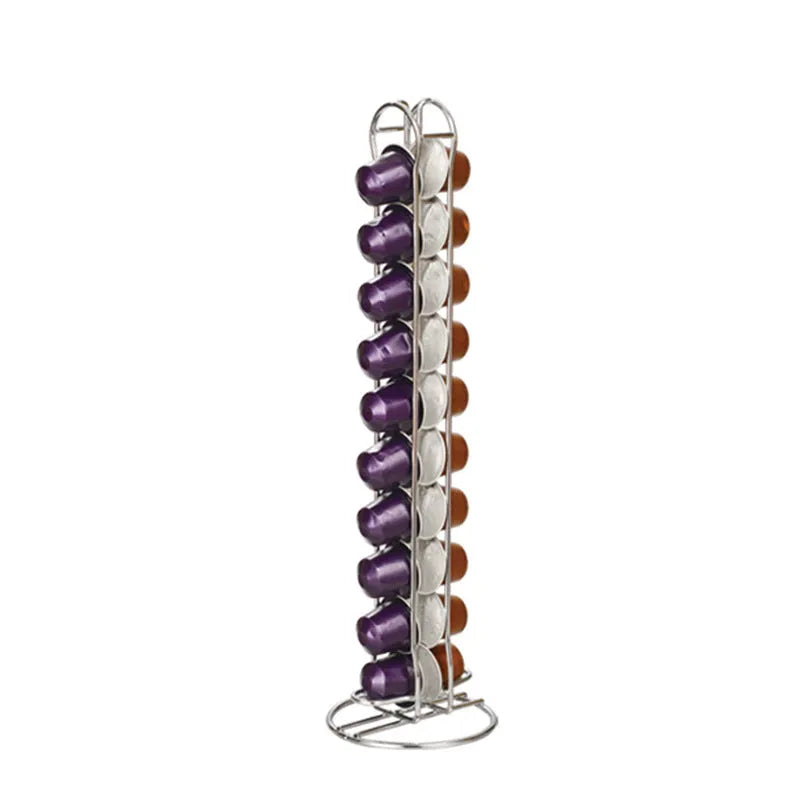 Black wrought iron coffee capsule storage rack holding pods on a kitchen counter.