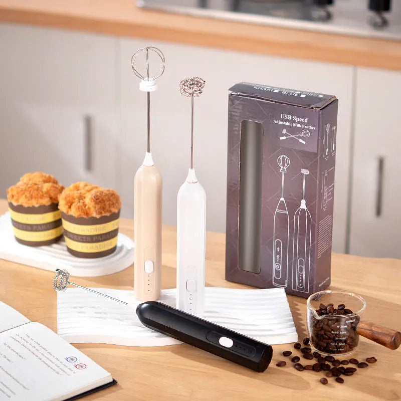 Handheld electric whisk in white, black, or apricot with USB rechargeable wireless design and three speed settings